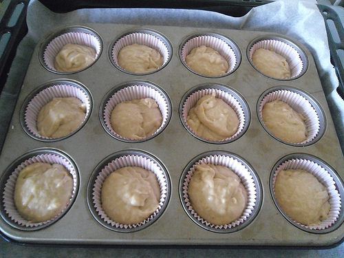 Pour batter in muffin cups