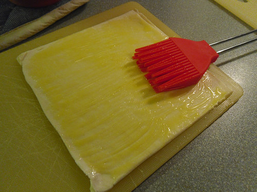 Buttering the puff pastry